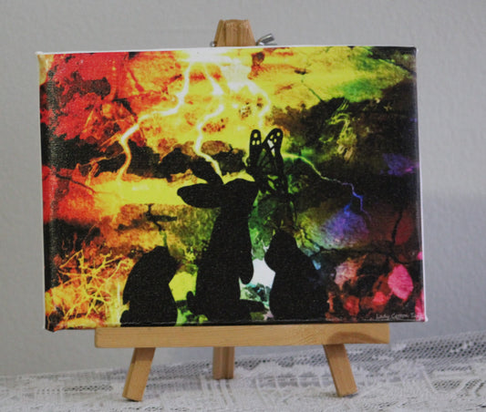 Bunny silhouettes in a whimsical thunderstorm canvas print 8x10